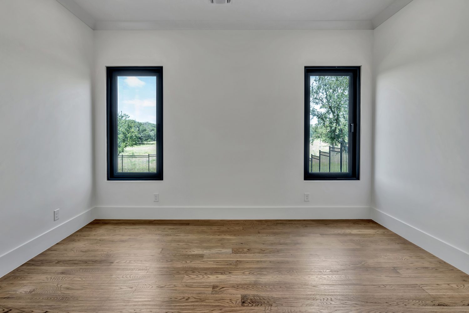 Bright interior room with black framed windows