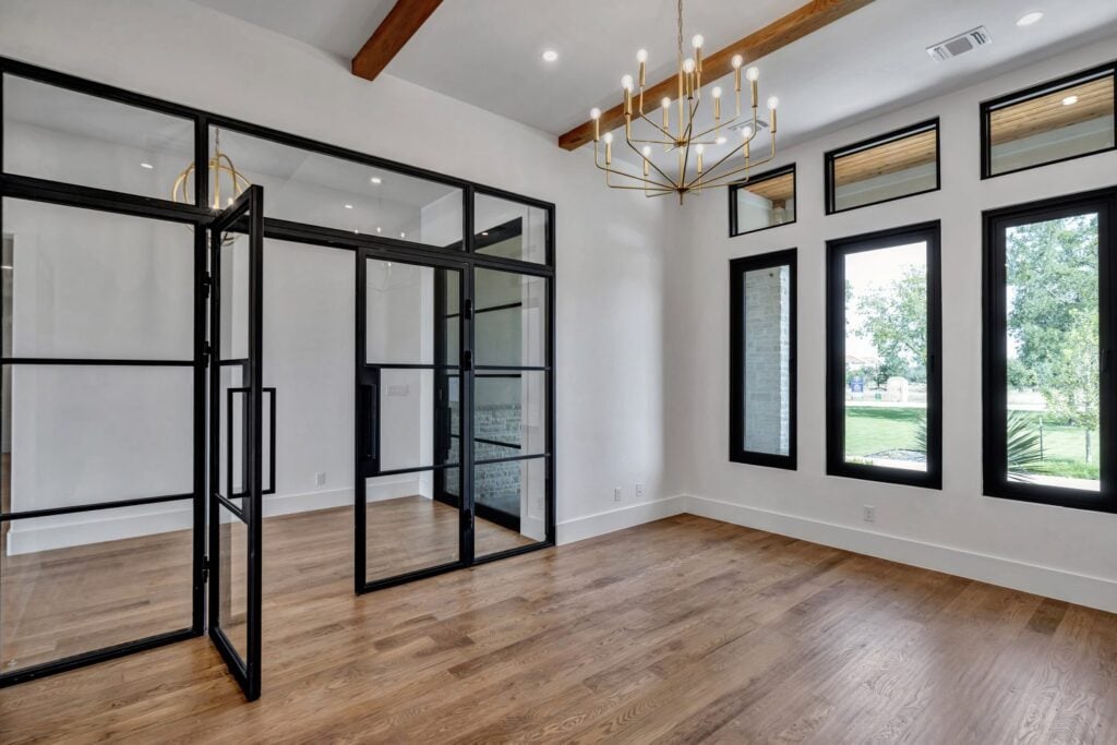 Custom steel double entry door with black frames during install, from Love That Door