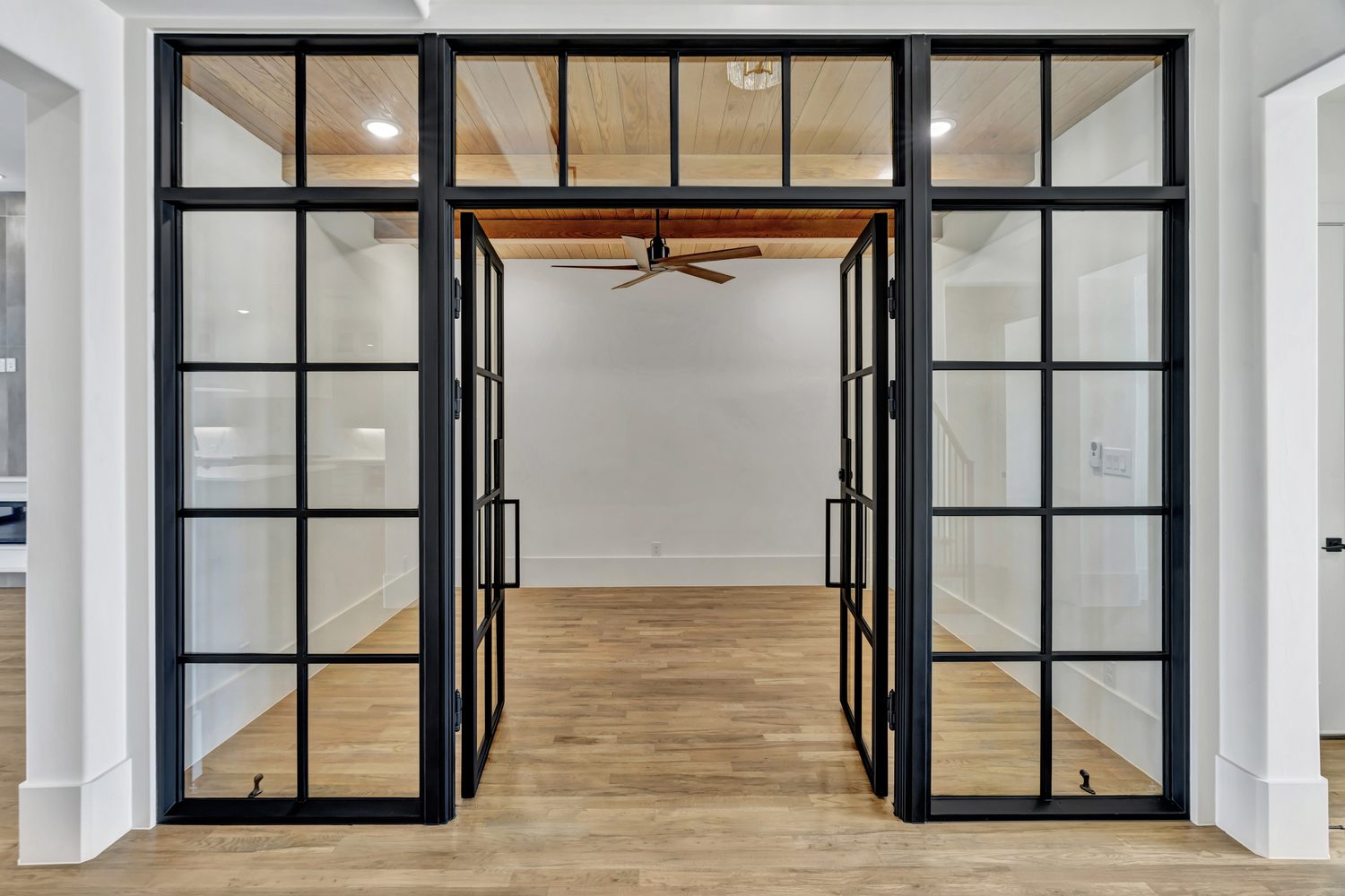 Custom steel double entry door in an interior foyer from Love That Door