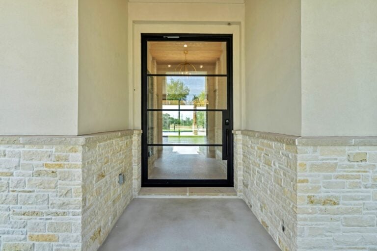 Custom steel entry door with black frame and clear glass from Love That Door custom door maker