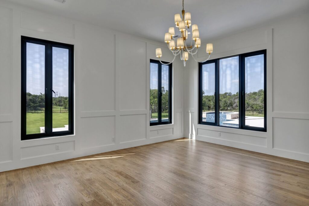 Modern living room with large black framed windows
