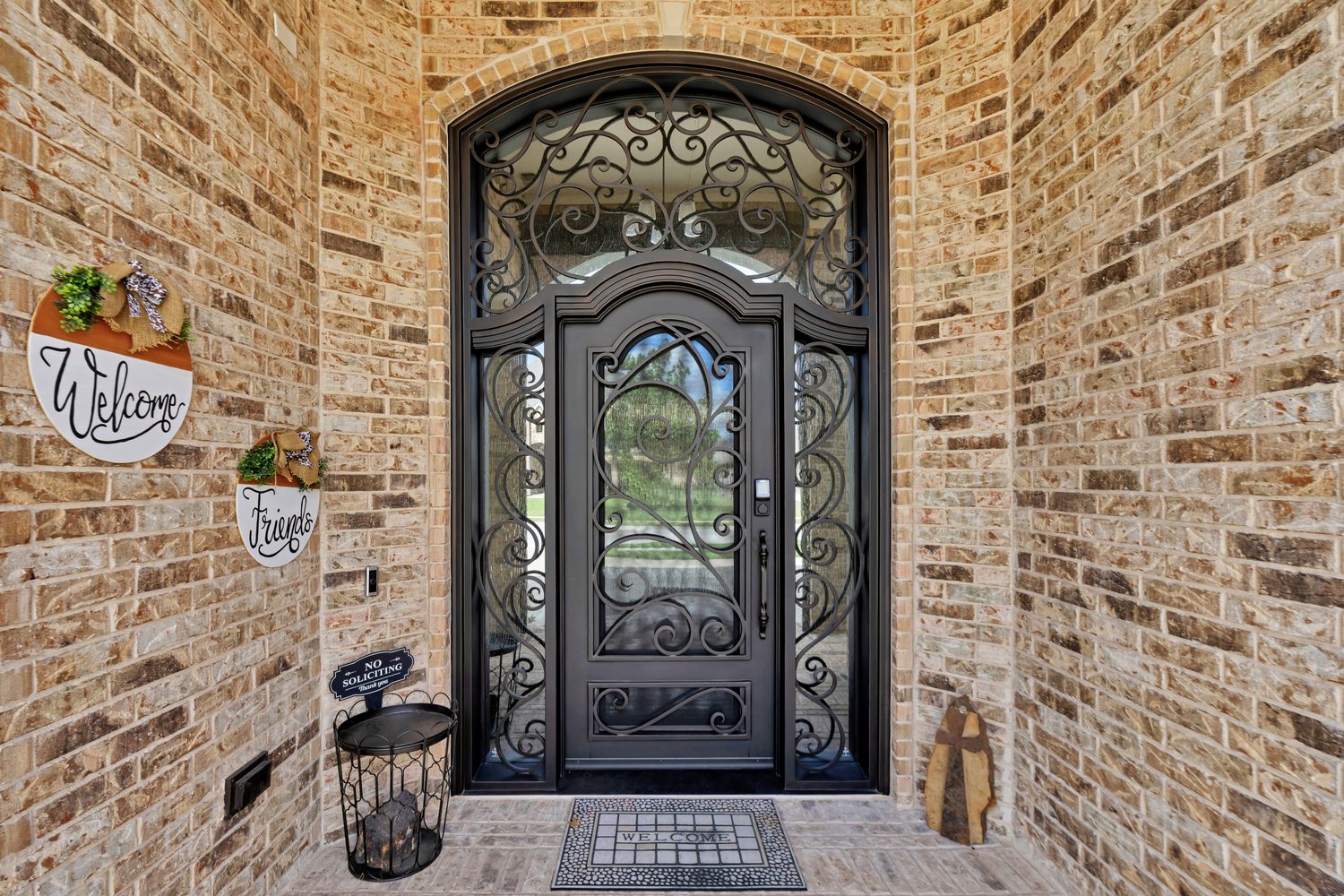 Traditional iron single door arched with scrollwork and transom from Love That Door
