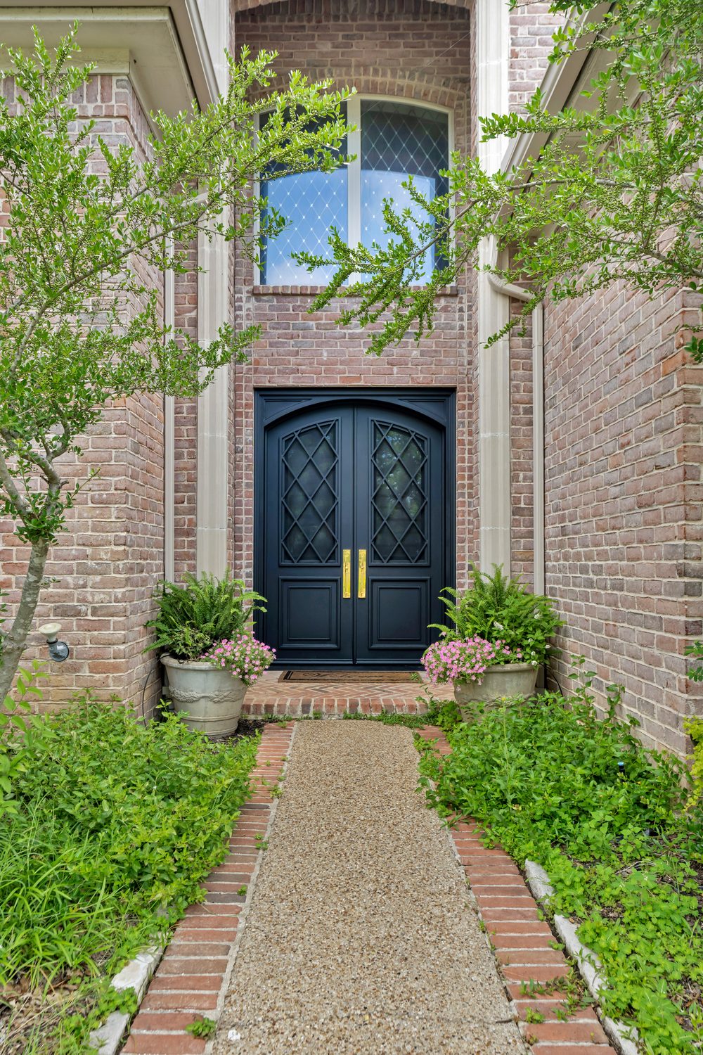 Traditional arched steel double door with diamond glass from Love That Door