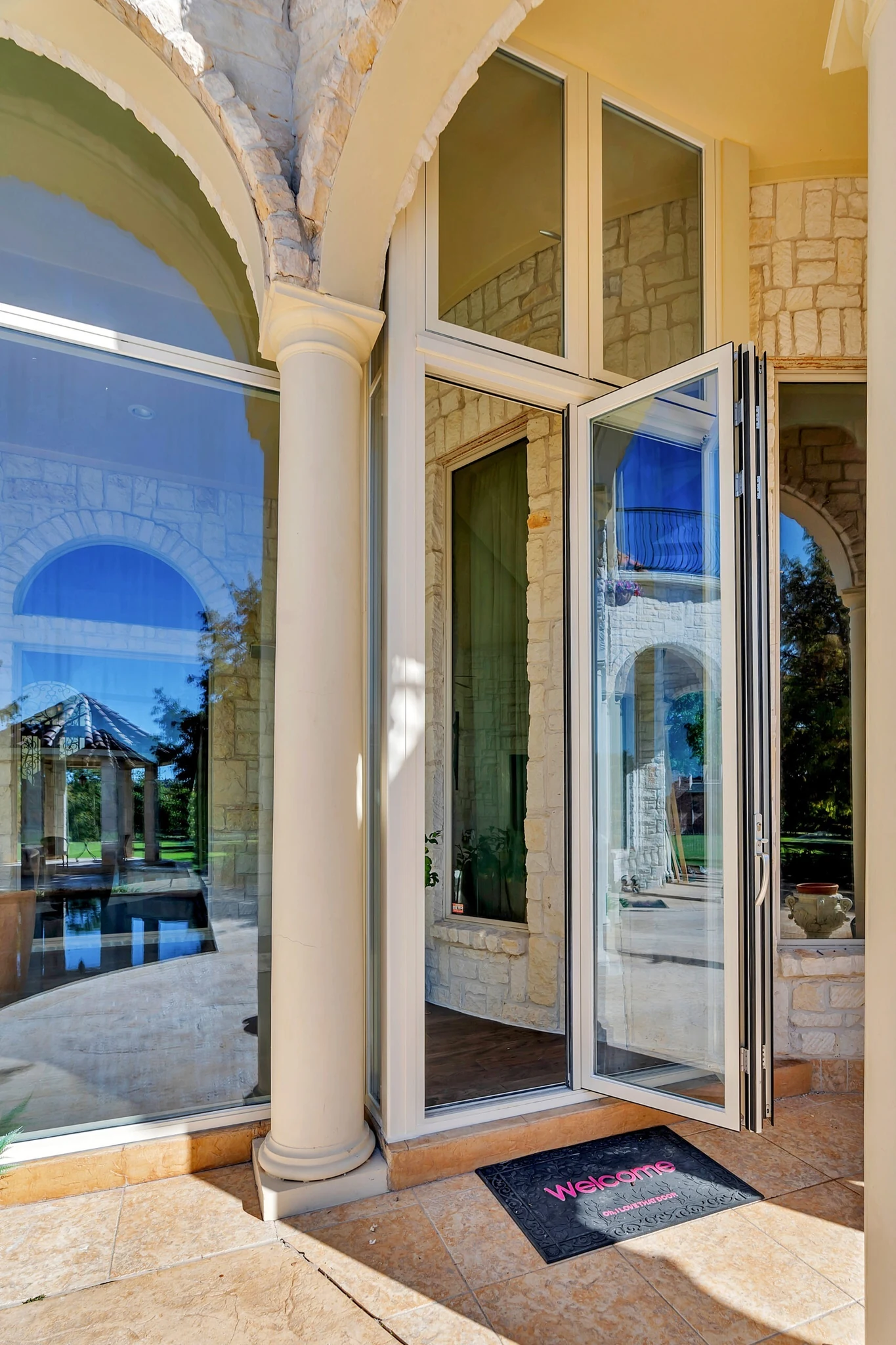 Aluminum four panel bifold door folded open