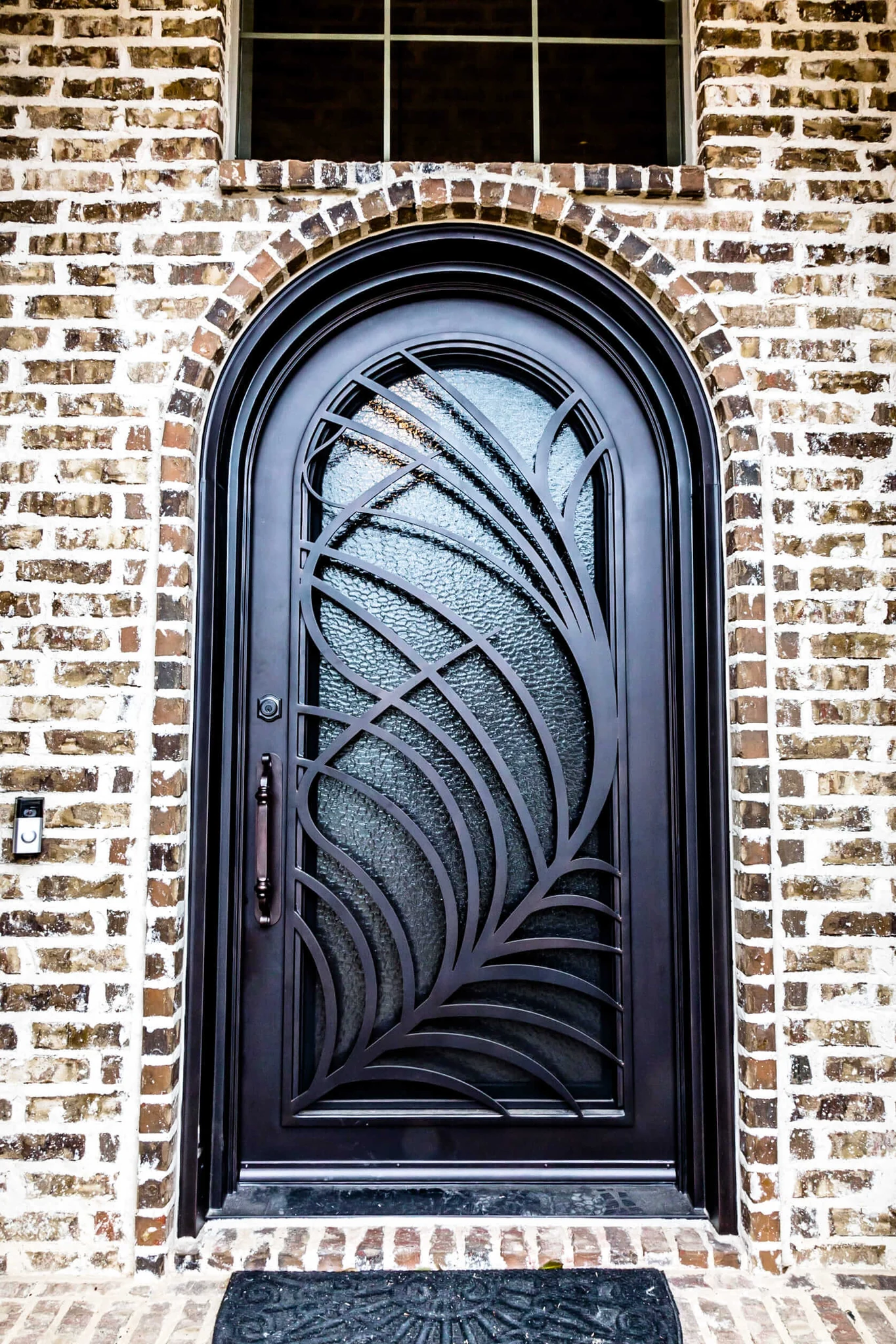 Arched steel entry door with leaf textured glass - Love That Door