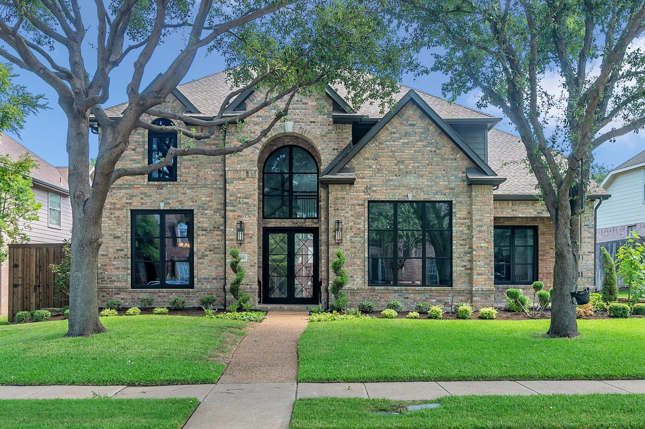 Black aluminum arched windows and doors