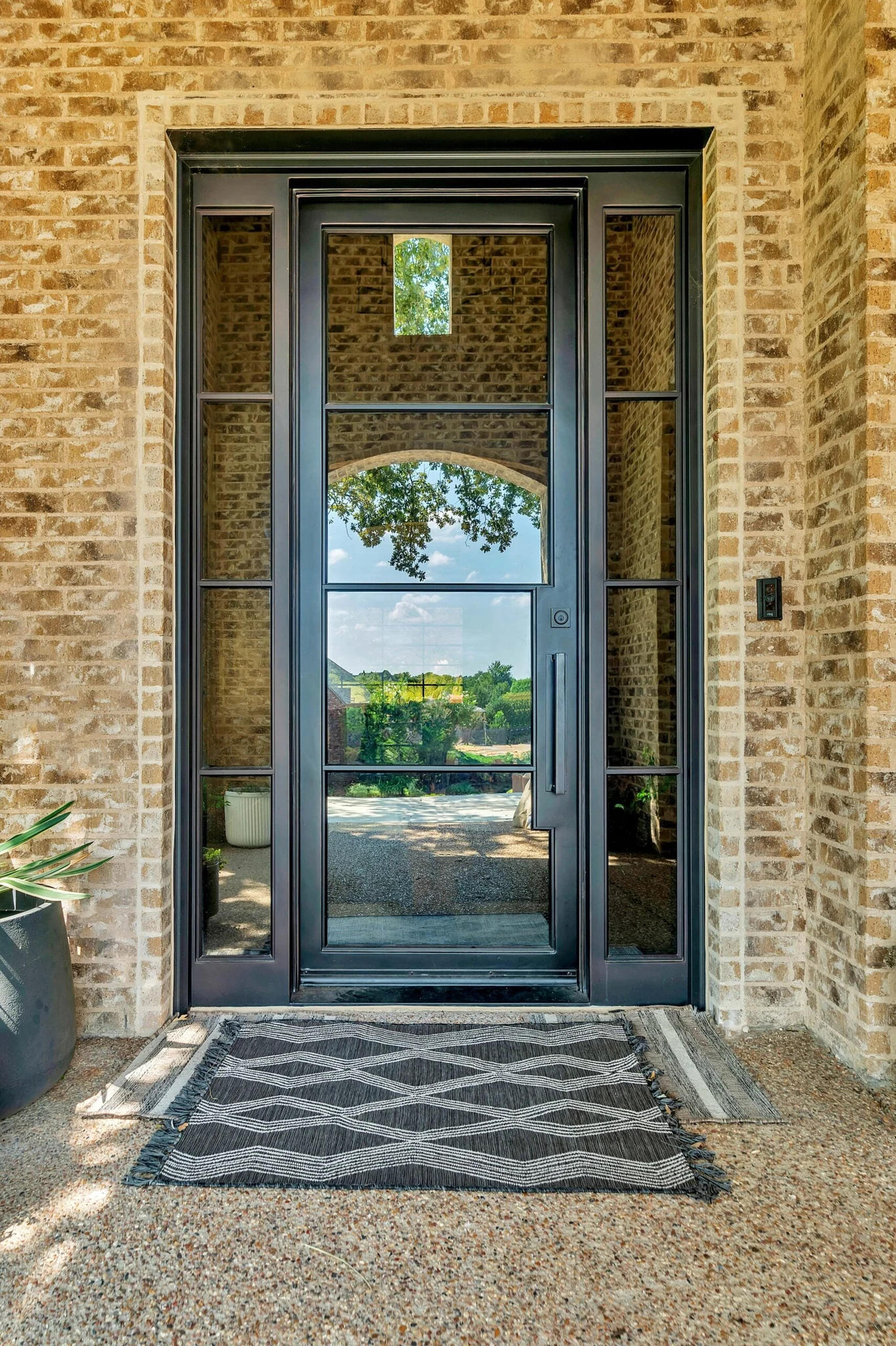 Black steel double rectangular entry door with sidelights and transom