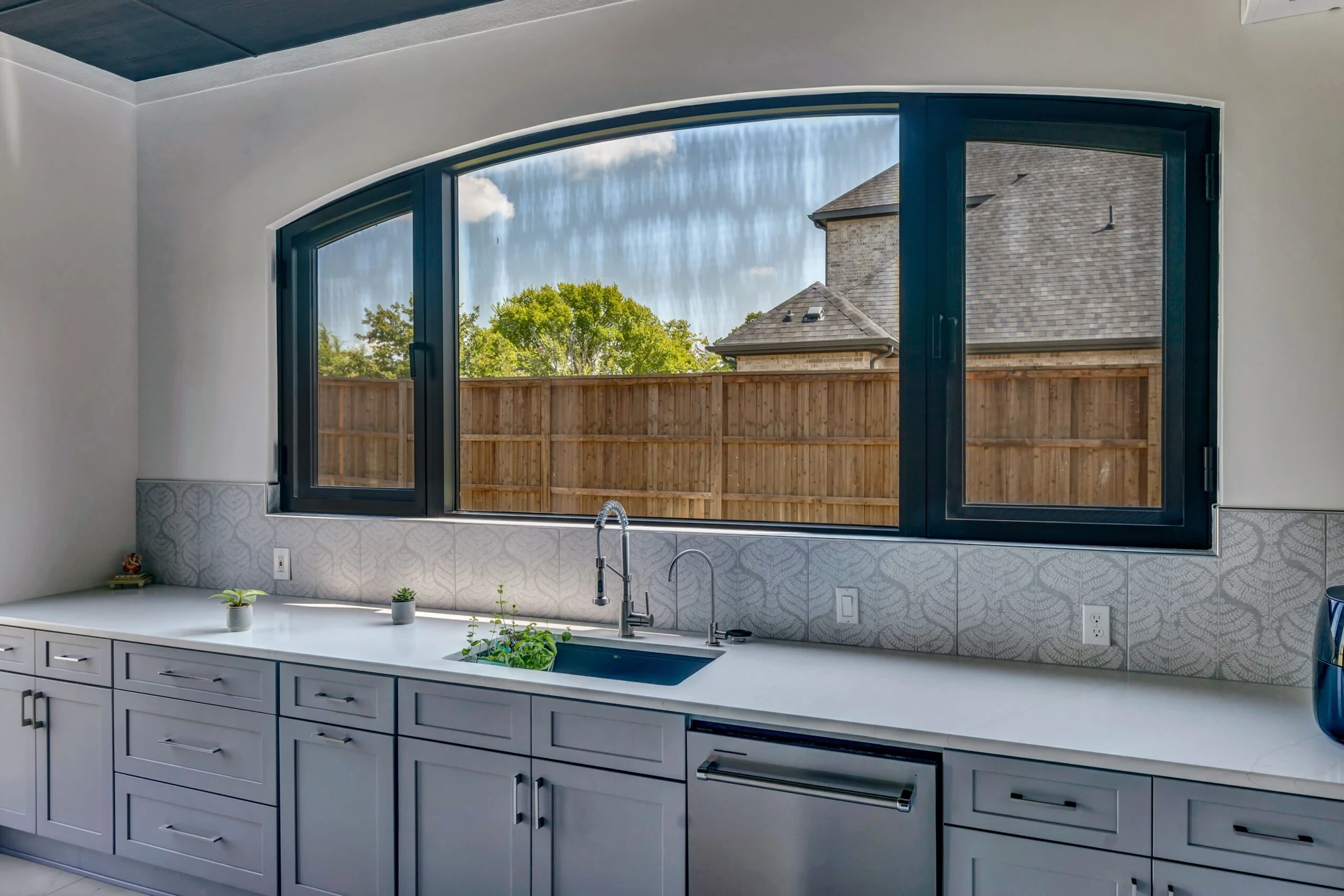 Dark aluminum arched window