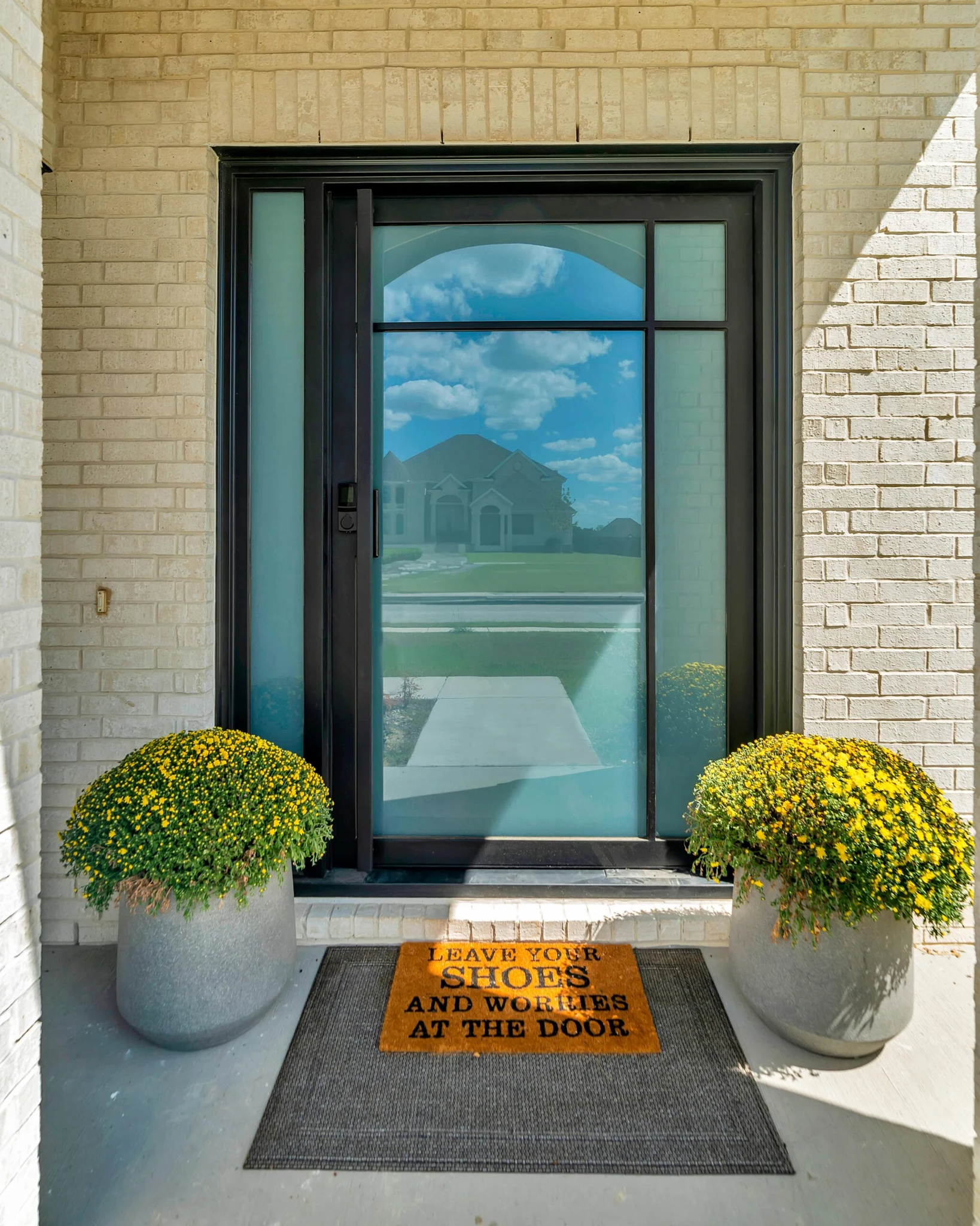 Double steel glass door with black frames and horizontal bar