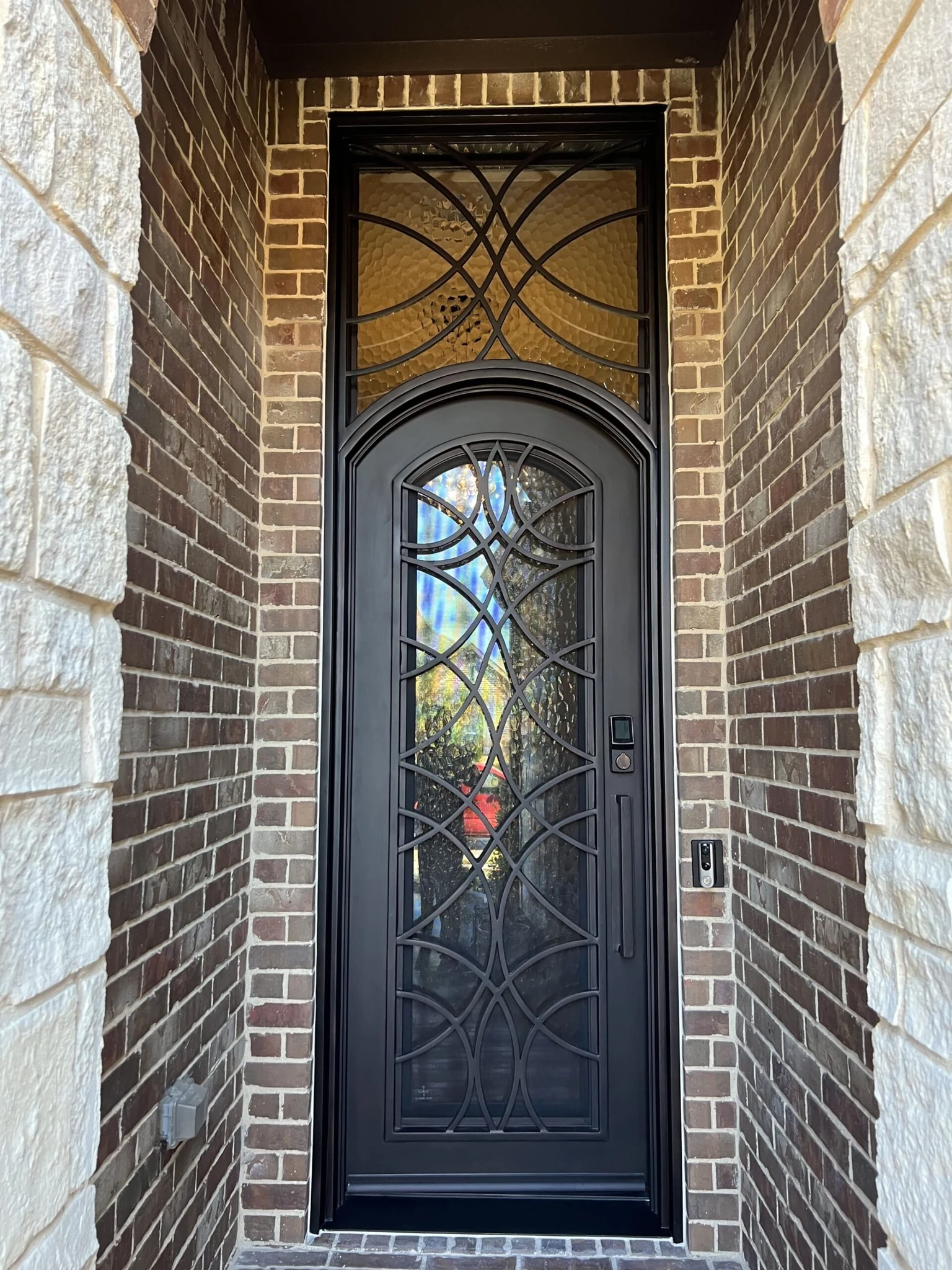 Eyebrow single entry door with square transom, black steel
