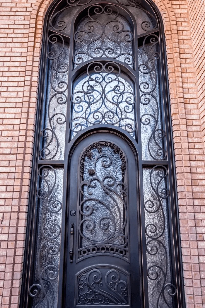 Midnight copper edges arch single entry door with surround