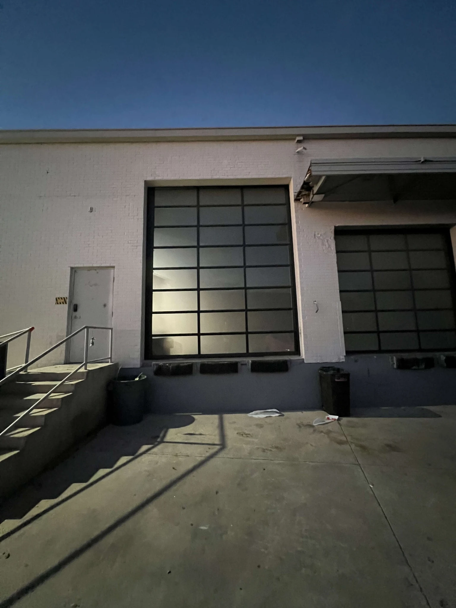 Modern black garage doors with grid pattern windows