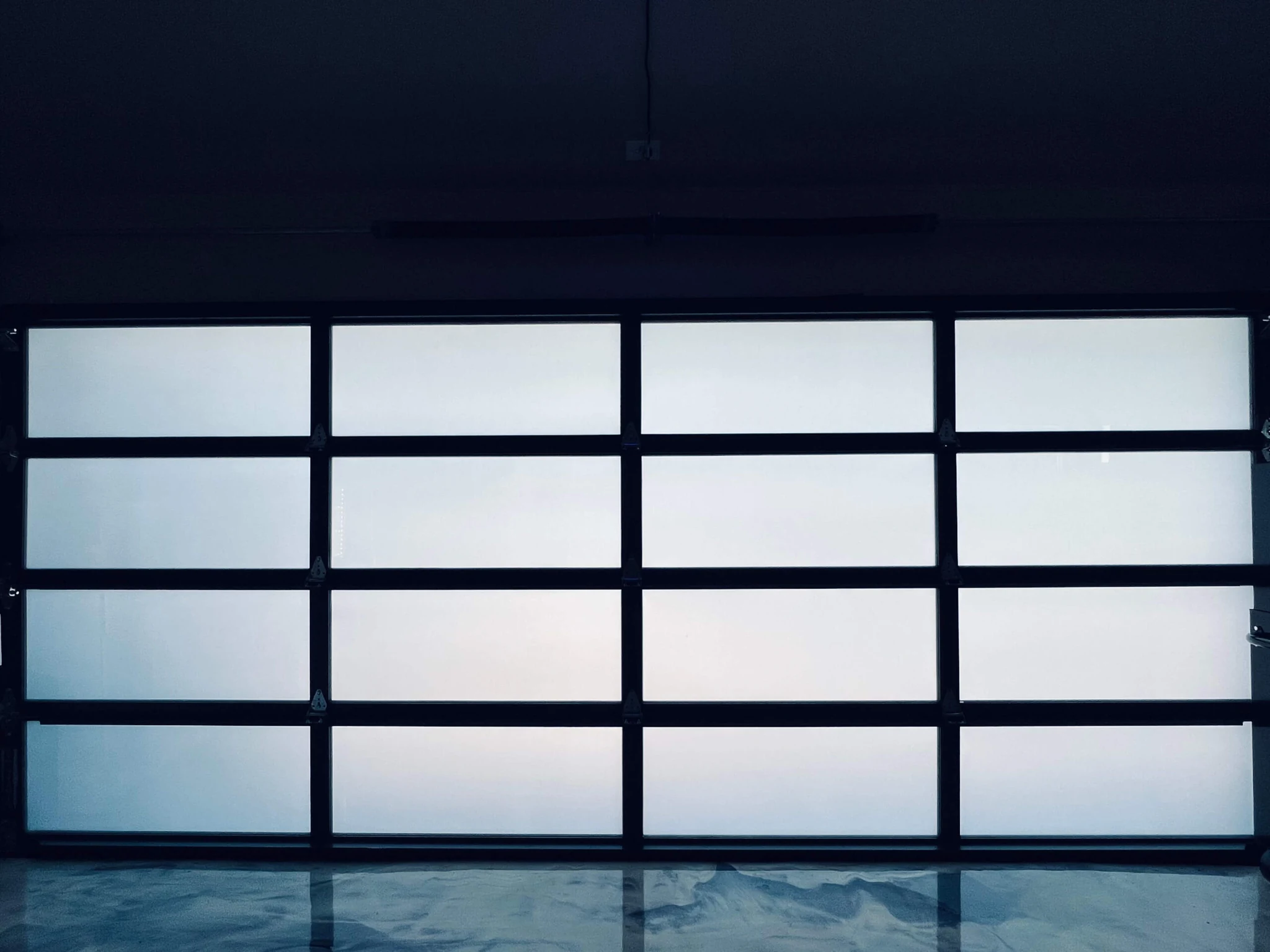 Modern double garage doors with frosted glass panels